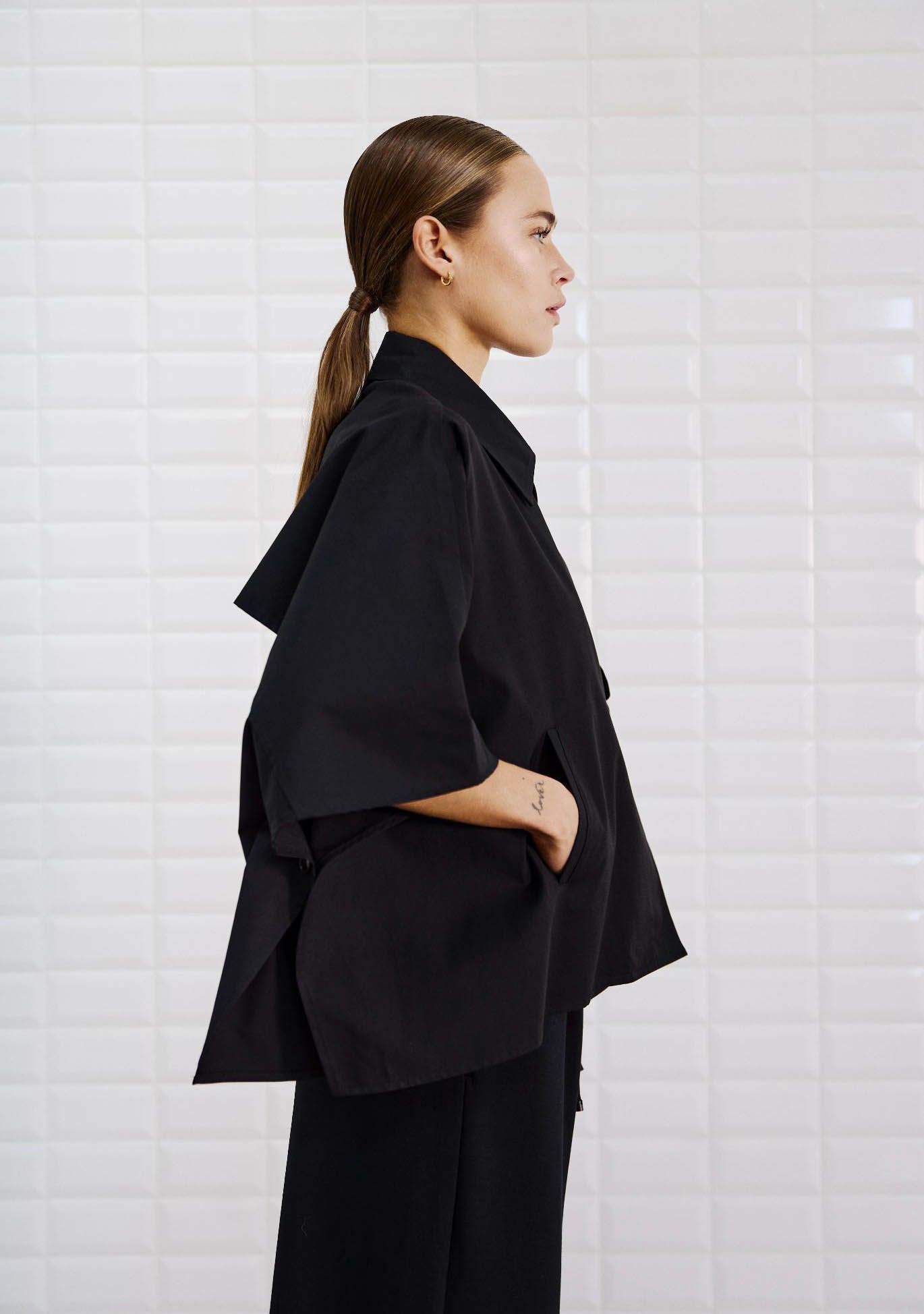 WITH BLACK TRENCHCOAT